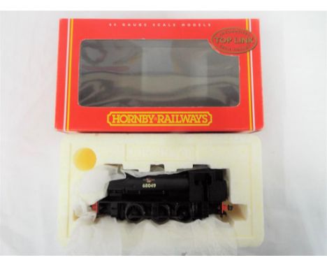 Hornby - an OO gauge 0-6-0ST saddle tank locomotive, class J94, op no 68049 # 2094A, appears mint in m window box