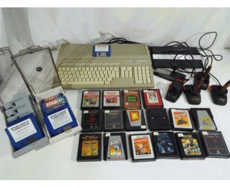 Vintage gaming - an Atari 520ST personal computer with a quantity of game and program discs to include Impossible Mission II,