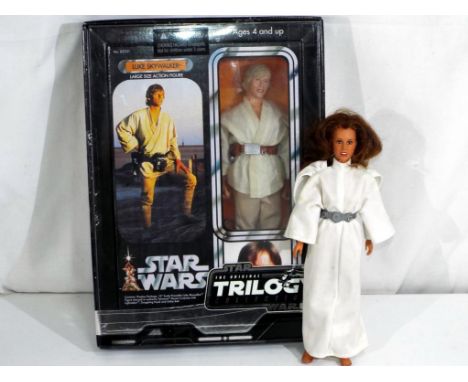 Star Wars by Kenner and Hasbro - an unboxed vintage large scale action figure of Princess Leia and a boxed Star Wars trilogy 