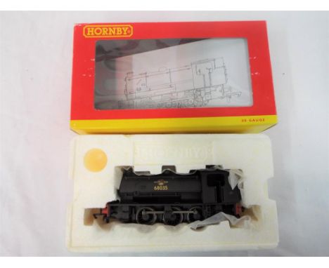 Hornby - an OO gauge 0-6-0ST saddle tank locomotive, class J94, op no 68035, weathered finish # 2533, appears mint in m windo