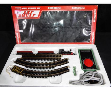 Fleischmann Start Set # 6315 comprising Tank locomotive, two goods wagons, twin rail track and power controller 6730, appears