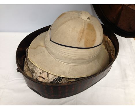 A SAFARI PITH HELMET "COMFORTEASE" 6 7/8 IN METAL PAINTED TIN 