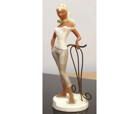 A RARE W. GOEBEL WOMAN IN 1950'S DRESS DATED 1956 BY A MULLER, MODEL FF250 23CM (FIGURE DETACHED FROM WIRE STAND BUT UNDAMAGE