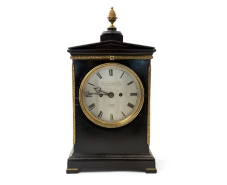 A Regency Thomas Gammage & Son of London bracket clock, ebonised case of architectural form with a gilt metal pineapple finia