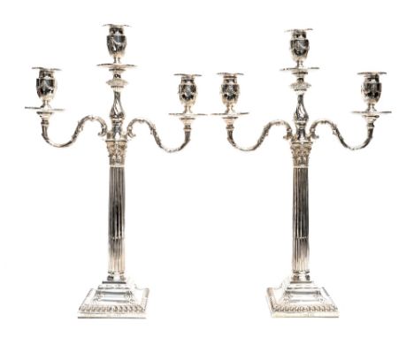 A pair of Victorian silver two branch candelabra, Corinthian column form on gadrooned square bases, removable acanthus S bran
