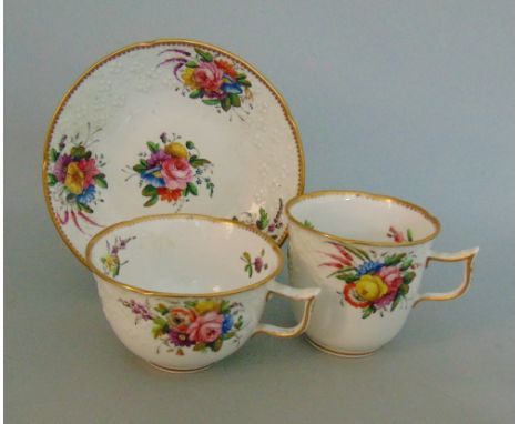 A Spode trio with a moulded border, decorated with floral sprays and gilded rims, pattern No. 2527, circa  1820,  marked Spod