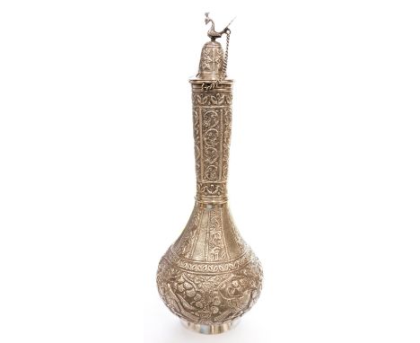 A Middle Eastern or Islamic silver coffee pot, embossed with flowers and birds, bird finial to the lid, 38 cm high approx, 25