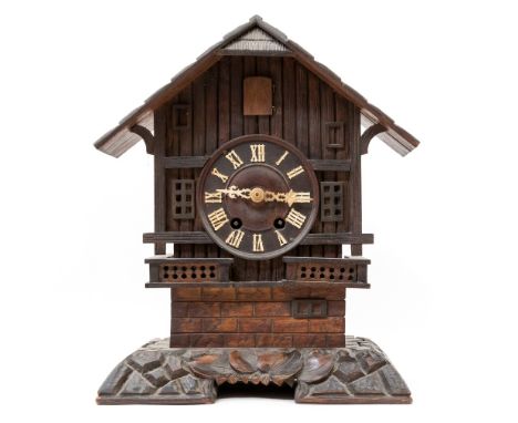 An early 20th Century Black Forest bracket cuckoo clock, modelled as a mountain chalet with pitched roof, height 42cmConditio