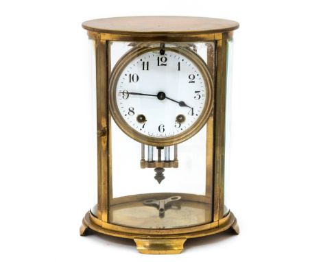 A late 19th Century four glass clock, oval brass case, bevelled glass, white enamel dial signed Seth Thomas USA, mercury pend