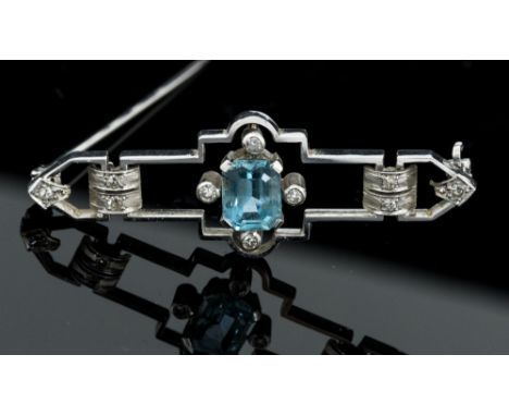 An Art Deco design aquamarine and diamond set 14ct white gold bar brooch with platinum setting, the central octagonal step cu