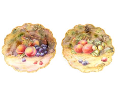 A pair of Royal Worcester fruit painted plates, decorated by T Lockyer, ogee gadrooned borders, plums, peaches and berries, 2