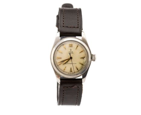 Tudor Rolex, a 1950's Tudor Rolex Oyster wristwatch, 2.5cm circular champagne dial with dagger numerals, branded crown, backp