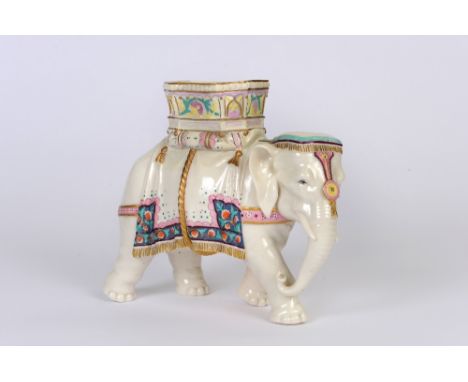 A Royal Worcester white glazed figural vase in the form of an Indian elephant with basket carrier, enamelled decoration, impr