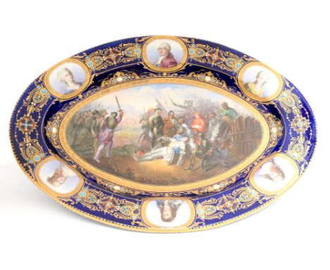 A Sevres oval cabinet plate, the central hand painted scene depicting le Mort de Gaston de Foix en 1512 from Bataille de Rave