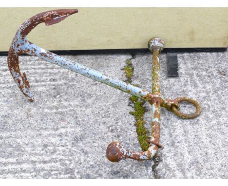 A cast iron ships anchor formerly painted in light blue. Approx. 83cm long overall