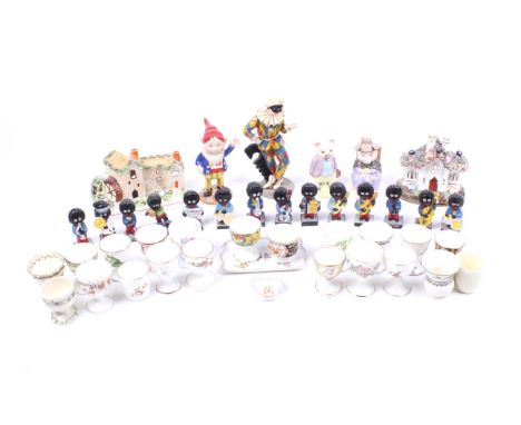 A collection of assorted china figures, items and gollies. Including Beatrix Potter pigs and a Royal Worcester Enid Blyton's 