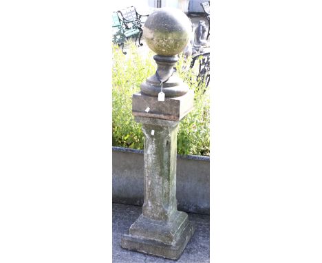 A reconstituted stone square plinth and an associated glazed ball finial. On a square base, this 46cm high; the plinth approx