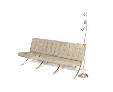After Mies Van De Rohe - 'Barcelona Pavillion' three-seater sofa and a floor light. With grey button back leather cushions on
