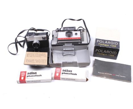 A vintage Polaroid Land Camera Automatic 104, accessories, etc. Including original instruction booklet and boxed flash, etc. 