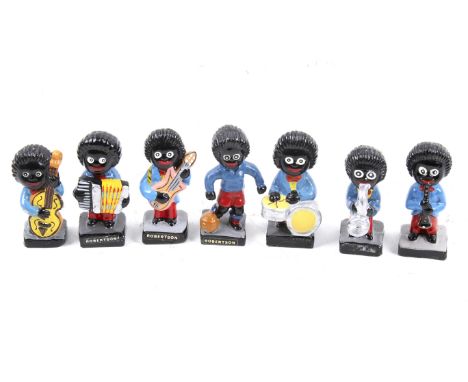 Seven Robertsons 'Golly' figures. Comprising a footballer and six musicians, H7.5cm Notice from the the-saleroom.com: These i