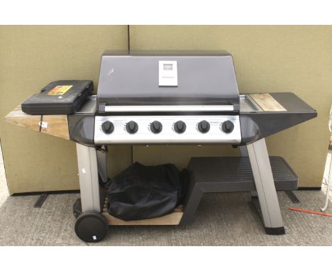 An Outback BBQ and an 18 piece barbecue tool set. On a trolley. H110cm x W177cm x D66cm 