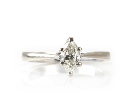 A white gold diamond single stone ring,  with a marquise cut diamond set to an open gallery collet, to a plain band, tested a