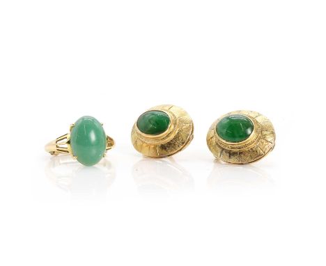 A pair of jade clip earrings and a jade ring, the earrings with oval jade cabochons, to omega clip fittings, and a jade ring,