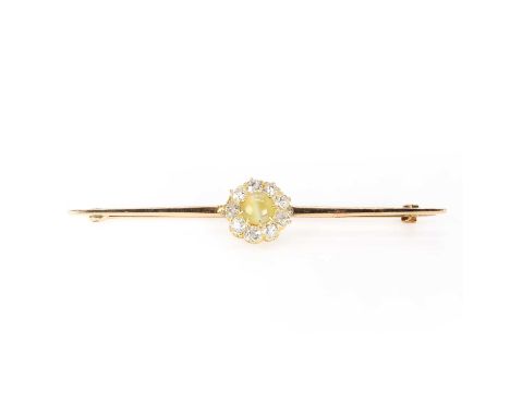 A late Victorian chrysoberyl cat's eye and diamond cluster,  later mounted to a bar brooch. A circular cabochon chrysoberyl c