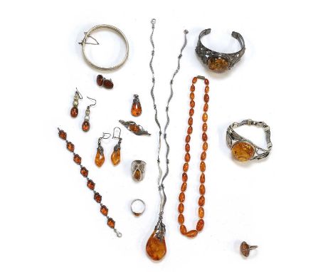 A collection of silver and amber jewellery, to include a silver clarified amber foliate cuff bangle, a silver clarified amber