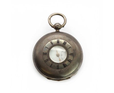 A silver key wind half hunter pocket watch, the engine turned cover with enamel Roman numerals, white enamel dial with Roman 