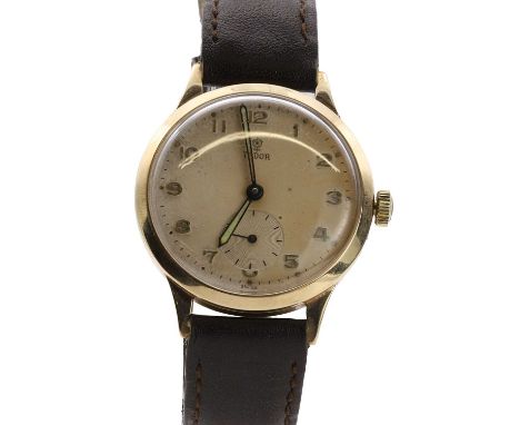 A 9ct gold Tudor mechanical strap watch,  with a 32mm diameter case, a silvered dial, gilt Arabic numerals, luminous sword ha