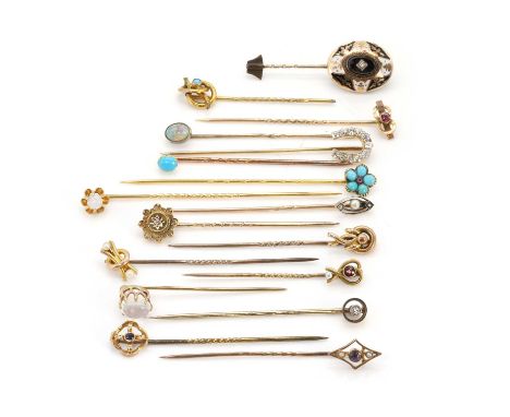 A collection of 17 assorted stick pins, to include a late Victorian diamond set horseshoe example, a diamond, onyx and black 