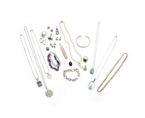 A group of silver gem set jewellery, to include a hollow cable link bracelet, an oval crossover bangle, an amethyst three row