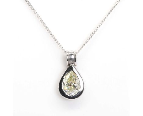 † A white gold mounted fancy coloured diamond drop shaped pendant, set with a pear cut natural coloured diamond with a stated