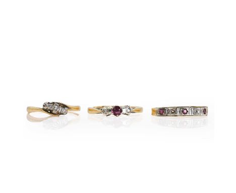 A small group of diamond and gemstone set rings, comprising:a gold diamond three stone crossover ring,with graduated eight cu