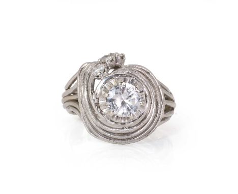 A white gold diamond wirework swirl design ring,  a central round brilliant cut diamond, two large chips to the girdle, estim