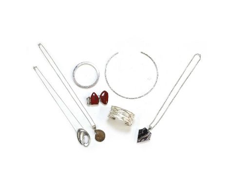 A collection of silver and hardstone jewellery, comprising a silver hammered torque necklace, internal measurements 130mm x 1