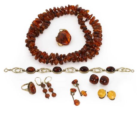 A group of amber jewellery, comprising a pair of gold and clarified amber stud earrings, mounts tested as approximately 14ct 