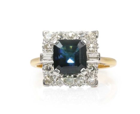 A sapphire and diamond cluster ring,  with a square step cut sapphire, claw set to a square surround faced in white with bagu