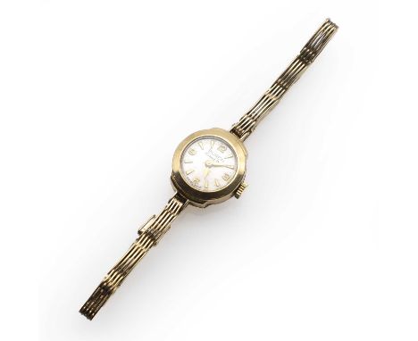 A ladies' 9ct gold Buren mechanical bracelet watch, with a round 15mm diameter case, a silvered dial, gilt Arabic and arrow h