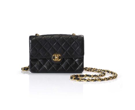 A Chanel black lambskin flap bag, with Paris Boutique CC closure, gold-tone hardware, leather and chain shoulder strap, inter