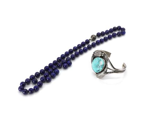 A Navajo silver and turquoise bangle by Robert Kelley, and a lapis lazuli necklace, A Navajo silver and turquoise torque bang
