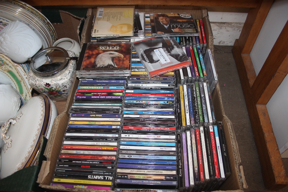 A box of various CDs