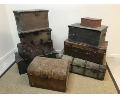 An 18th Century studded pony hide covered dome top trunk bearing paper-lined interior with maker's label "W Illman &amp; Son 
