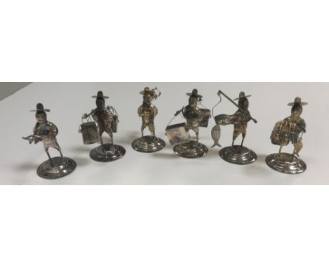 A collection of six Hong Kong Chinese sterling silver figures of fishermen and traders, the tallest 6 cm high, total weight a