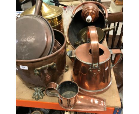 A collection of various copper and brass ware to include three copper warming pans with turned wooden handles, a copper "boot