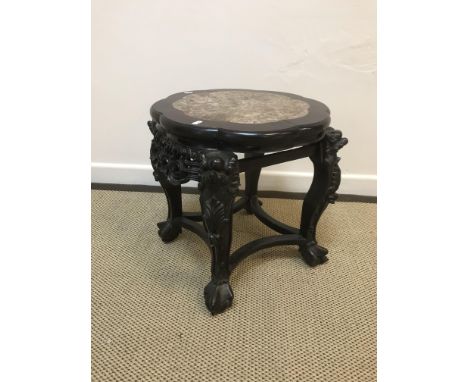 A Chinese rosewood urn stand, the Rosso marble flower head shaped top within a moulded edge, raised on grotesque mask and fol