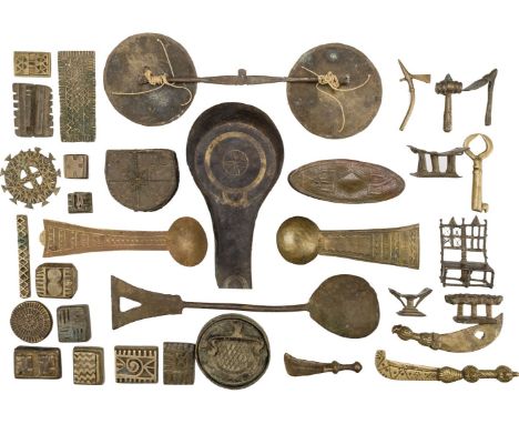 * Ashanti. A collection of gold weights and related items, comprising, a pair of scales, 10 gold dust spoons, 5 gold dust box