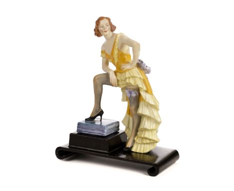 * Royal Crown Derby. A 1930s porcelain figure modelled as the German actress Anny Ahlers, the base with red backstamp and 'Sp