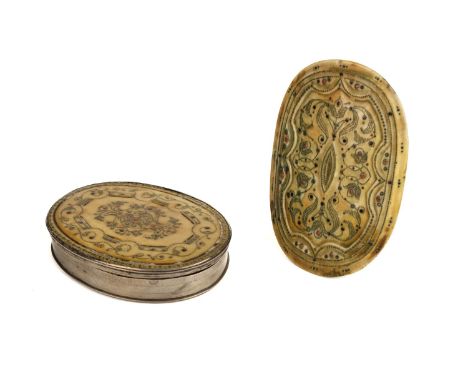 * Snuff box. A late 17th century ivory and piqué work oval snuff box, the lid inlaid with a central panel of scrolls formed w